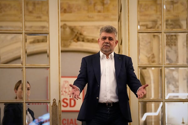 Romanian Prime Minister Marcel Ciolacu gestures at the PSD headquarters before announcing his resignation, in Bucharest, Romania, Monday, May 5, 2025, the day after the governing coalition's candidate failed to advance to the runoff in the presidential election rerun. (AP Photo/Andreea Alexandru)