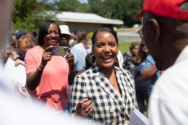 Former Atlanta mayor Keisha Lance Bottoms, the Democratic nominee for governor, campaigns outside of a shuttered rural hospital in Commerce on Wednesday. (Riley Bunch/AJC)