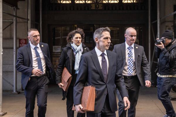 
                        Matthew Colangelo, center, and Susan Hoffinger, second from left, prosecutors with the Manhattan district attorney's office, in Manhattan, March 30, 2023. A Manhattan grand jury voted to indict Donald J. Trump on Thursday for his role in paying hush money to a porn star, according to four people with knowledge of the matter. (Dave Sanders/The New York Times)
                      