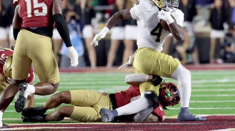 Notre Dame running back Jeremiyah Love (right) and the Fighting Irish figure to benefit most from top-10 teams Vanderbilt, Georgia Tech and Miami losing Saturday, Nov. 1, 2025. Notre Dame in the race for a spot in the 12-team College Football Playoff field.  (Mark Stockwell/AP)