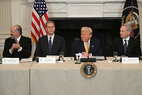 Secretary of Commerce Howard Lutnick, from left, Treasury Secretary Scott Bessent, President Donald Trump and White House AI and crypto czar David Sacks attend the White House Crypto Summit in Washington, Friday, March 7, 2025. (Pool via AP)
