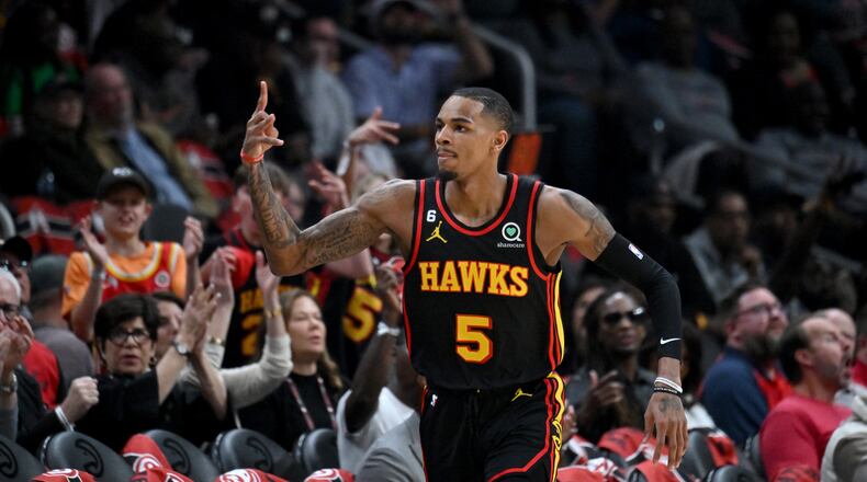 Atlanta Hawks guard Dejounte Murray (5) celebrates after scoring during the first half in Game 4 of the first round of the Eastern Conference playoffs at State Farm Arena, Sunday, April 23, 2023, in Atlanta. (Hyosub Shin / Hyosub.Shin@ajc.com)