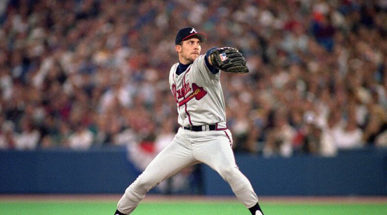 John Smoltz as you remember him, serving sliders for the Braves. (Photo by Rick Stewart/Getty Images)