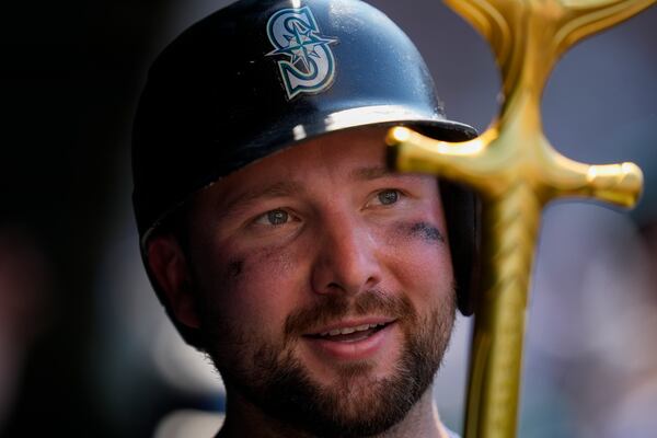 Seattle Mariners' Cal Raleigh holds the "home run trident" after hitting a two-run a home run during the seventh inning of a baseball game against the Chicago Cubs, Friday, June 20, 2025, in Chicago. (AP Photo/Erin Hooley)