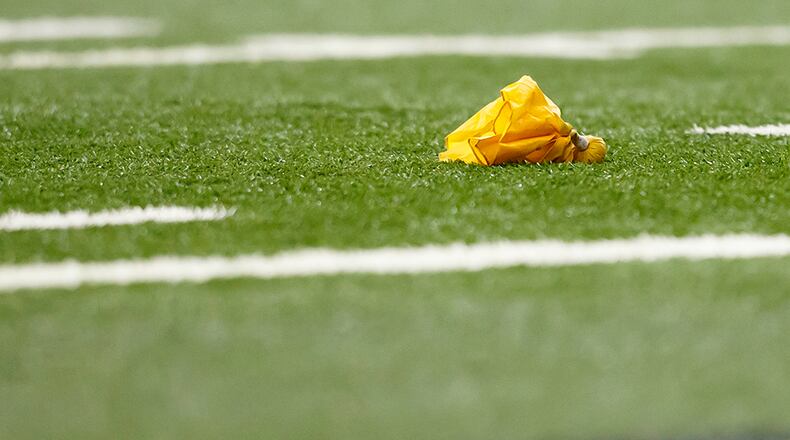 Penalty flag is seen on the field during an NFL football game between the Detroit Lions and the Arizona Cardinals at Ford Field in Detroit, Sunday, Oct. 11, 2015. (AP Photo/Rick Osentoski)