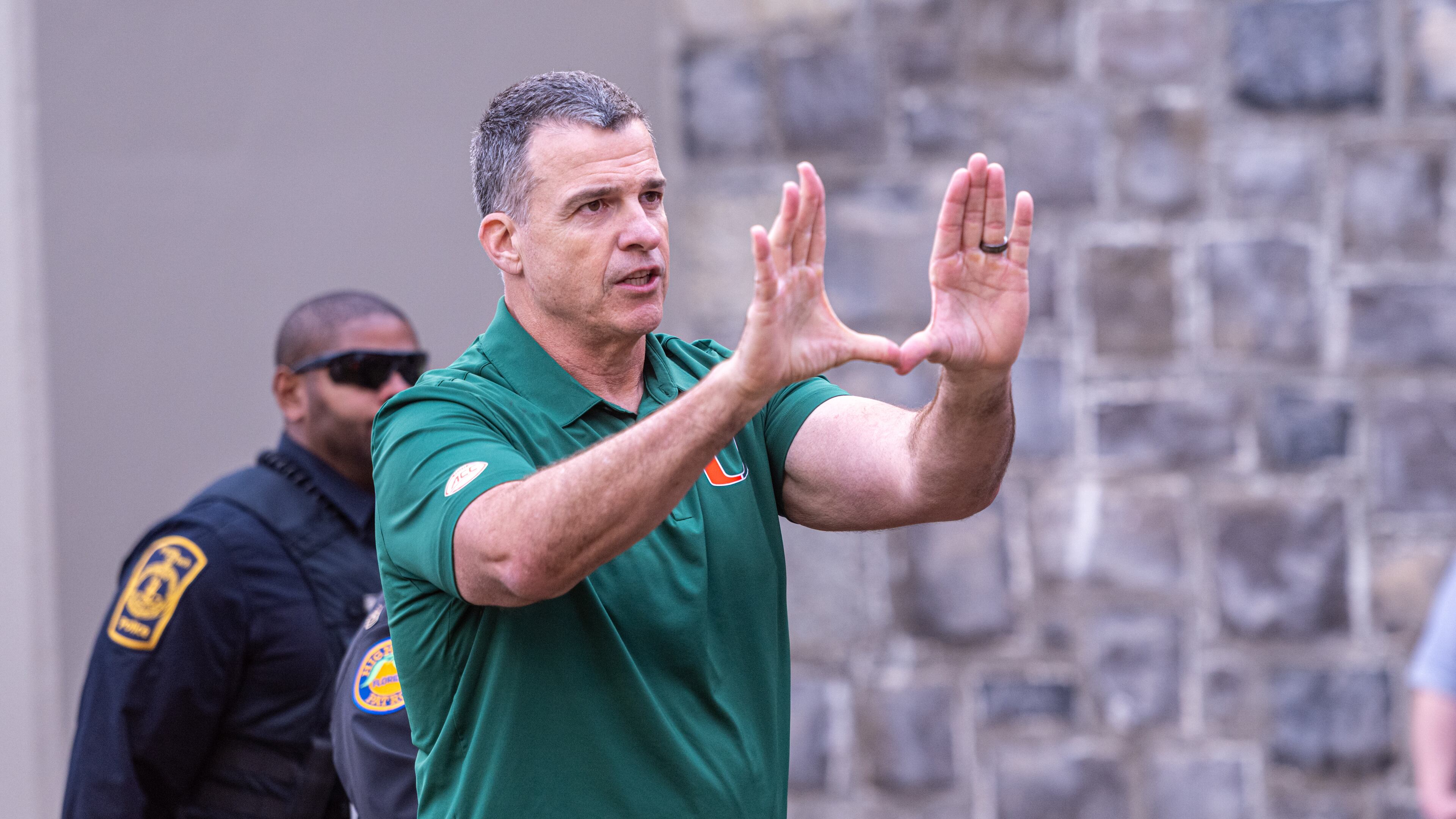 Miami head coach Mario Cristobal gestures towards the fans after defeating Virginia Tech in an NCAA college football game, Saturday, Nov. 22, 2025, in Blacksburg, Va. (AP Photo/Robert Simmons)