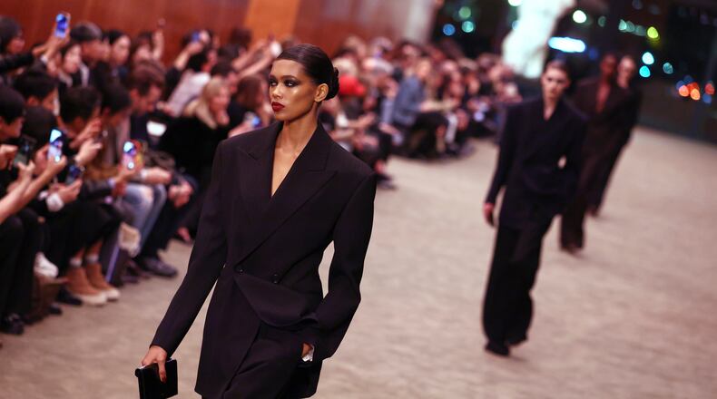 Models wear creations from the Saint Laurent Fall/Winter 2026-2027 Women's collection presented in Paris, Tuesday, March 3, 2026. (AP Photo/Tom Nicholson)