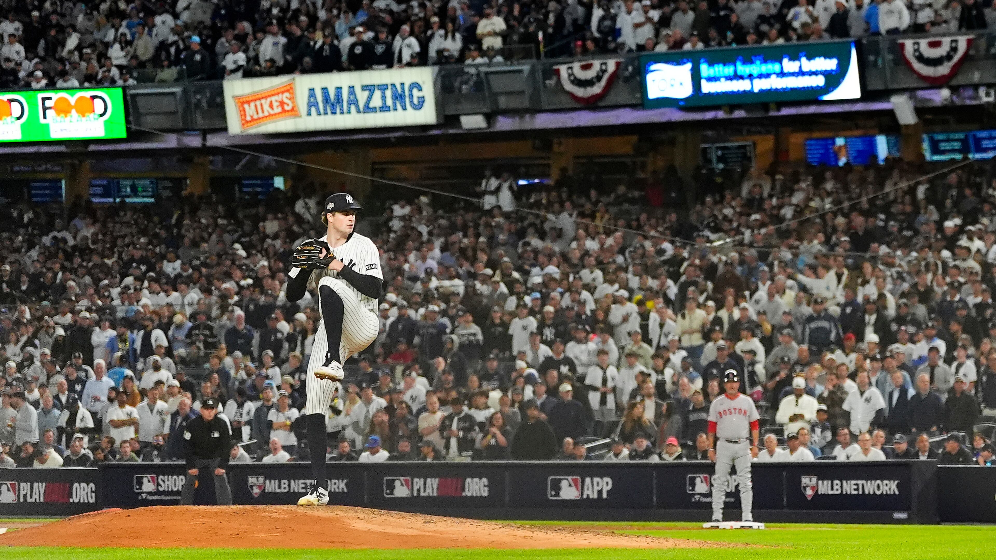 New York Yankees pitcher Cam Schlittler delivers against the Boston Red Sox during the eighth inning of Game 3 of an American League wild-card baseball playoff series, Thursday, Oct. 2, 2025, in New York. (AP Photo/Yuki Iwamura)