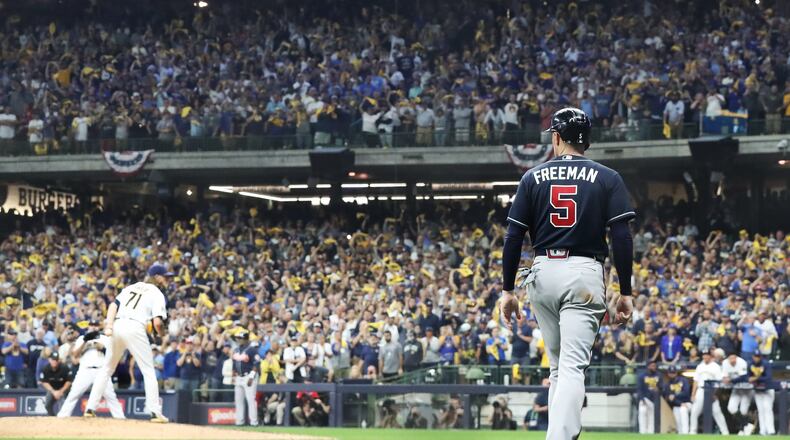 Braves first baseman Freddie Freeman is left on third base with Orlando Arcia batting for the final out in the ninth inning with Milwaukee Brewers closer Josh Hader finishing the Braves' last chance for a 2-1 Brewers victory during Game 1 of the NLDS series Friday, Oct. 8, 2021, in Milwaukee. (Curtis Compton / Curtis.Compton@ajc.com)
