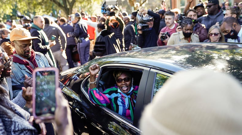 Ahmaud Arbery’s mother Wanda Cooper-Jones gestures to supporters as she leaves the Glynn County Courthouse in Brunswick, Ga., on Wednesday, Nov. 24, 2021, after the jury found three men guilty of murder and other charges for the pursuit and fatal shooting of Ahmaud Arbery. In a country whose cavernous divides over race, guns and vigilante violence have been on display recently in courtrooms, the guilty verdicts on Wednesday were hailed by political leaders and many Americans across the political spectrum. (Nicole Craine/The New York Times)