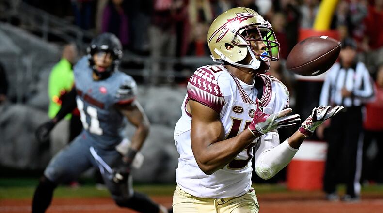 RALEIGH, NC - NOVEMBER 05: Wide receiver Travis Rudolph #15 of the Florida State Seminoles makes a touchdown reception against the North Carolina State Wolfpack at Carter-Finley Stadium on November 5, 2016 in Raleigh, North Carolina. (Photo by Mike Comer/Getty Images)