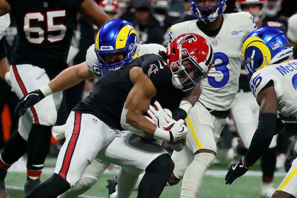 Falcons running back Bijan Robinson, getting tackled for once.