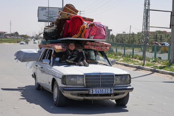 Displaced Palestinians, who flee from Rafah, arrive in Khan Younis, Gaza, on Monday, March 31, 2025, after the Israeli military issued sweeping evacuation orders covering most of Rafah. (AP Photo/Abdel Kareem Hana)