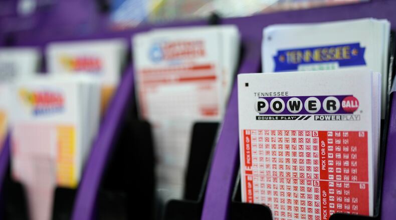 FILE - A Powerball play slip is seen at a store, Dec. 17, 2025, in Nashville, Tenn. (AP Photo/George Walker IV, File)
