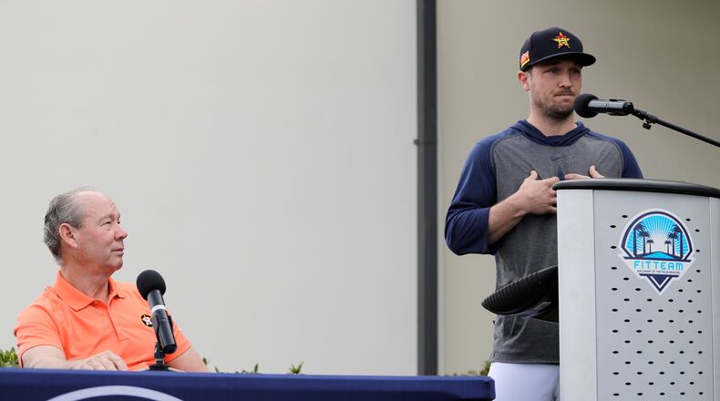 Houston Astros' Alex Bregman (right) delivers a statement regarding the 2017 sign-stealing scheme as Astros owner Jim Crane listens during a news conference before the start of the first official spring training baseball practice for the team Thursday, Feb. 13, 2020, in West Palm Beach, Fla.