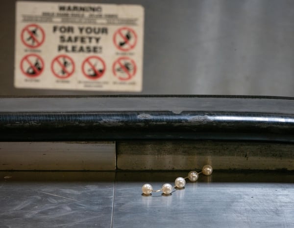 Broken jewelry was left behind inside the Vine City MARTA station on Tuesday, July 15, 2025 after at least 11 people were injured following a Beyonce concert after an accident occurred with the station escalator. (Ben Hendren for the AJC)