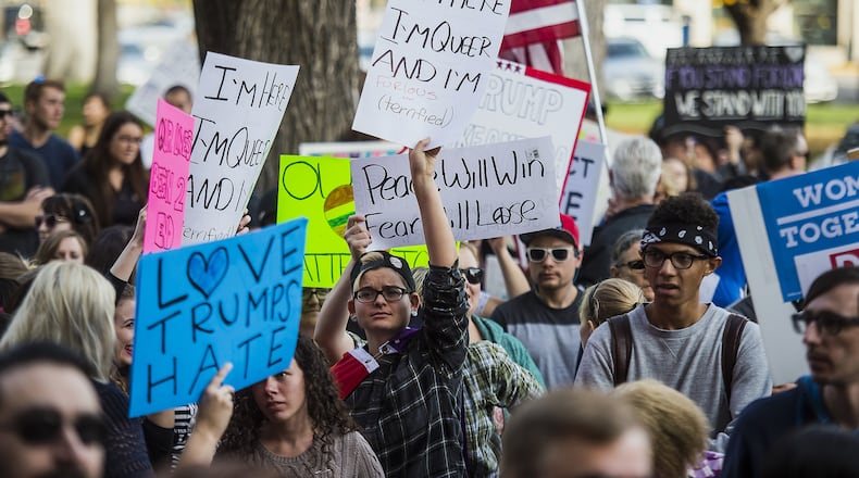 Protesters rally during a "Protests Trump" event in Salt Lake City on Saturday, Nov. 12, 2016. Tens of thousands of people marched in streets across the United States on Saturday, staging the fourth day of protests of Donald Trump's surprise victory as president. (Chris Detrick/The Salt Lake Tribune via AP)