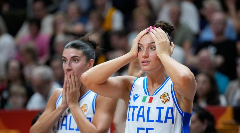 Italian players reactduring the Women's Basketball World Cup match between the United States and Italy in Berlin, Sunday, Sept. 6, 2026. (AP Photo/Ebrahim Noroozi)