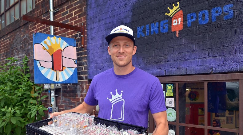 160711 Atlanta, Georgia: *Probably best shot for lead art* King of Pops manufacturing and factory tour, located in Atlanta's Historic Inman Park area. Co-owner Steven Carse, holds a fresh made tray of Watermelon Mojito pops just outside the pop making facility and Beltline accessible sales area in Inman Park. All photos taken Monday July 11, 2016. (Photo by Chris Hunt/Special) for story 080416pops