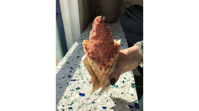 Pretty in pink: Big Softie’s waffle cone is filled with soft serve, coated with a strawberry shell and sprinkled with pink praline. Every component is made in the kitchen shared with sister establishment Little Tart Bakeshop at Summerhill. / CONTRIBUTED BY WENDELL BROCK