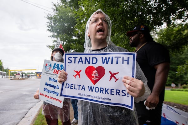 Ryan, a community supporter chants slogans at a Delta airline labor rally near Hartsfield-Jackson International Airport in Atlanta on Wednesday, July 17, 2024.  (Ziyu Julian Zhu / AJC)