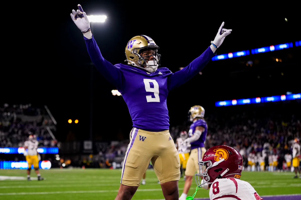 Washington cornerback Thaddeus Dixon celebrates after breaking up a pass to USC wide receiver Ja’Kobi Lane (lower right) during the 2024 season. (Lindsey Wasson/AP)