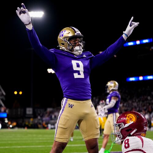 Washington cornerback Thaddeus Dixon celebrates after breaking up a pass to USC wide receiver Ja’Kobi Lane (lower right) during the 2024 season. (Lindsey Wasson/AP)