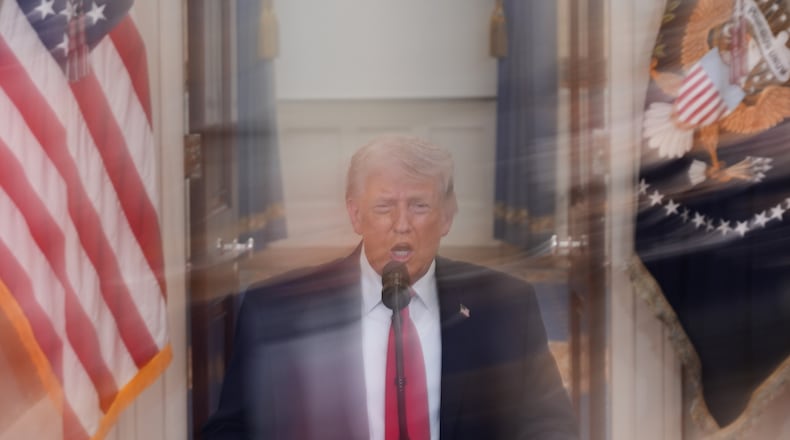 In this image made with a long exposure, President Donald Trump speaks about the Iran war from the Cross Hall of the White House on Wednesday, April 1, 2026, in Washington. (AP Photo/Alex Brandon, Pool)