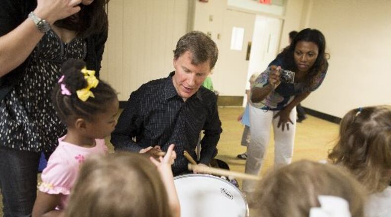 Atlanta Symphony Orchestra principal percussionist Tom Sherwood introduce kids to drumming during an ASO Instrument Petting Zoo event. CONTRIBUTED BY JEFF ROFFMAN