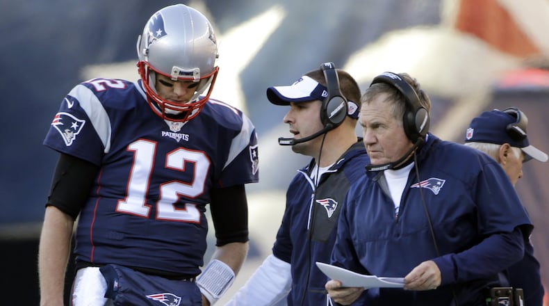 New England Patriots quarterback Tom Brady stands by head coach Bill Belichick during the first half of a Dec. 4, 2016, game against the Los Angeles Rams in Foxborough, Mass. (AP Photo/Elise Amendola)