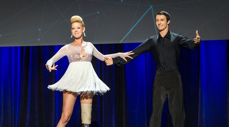 Dancer Adrianne Haslet-Davis, left, performs on stage with dancer Christian Lightner at the 2014 TED Conference in Vancouver, British Columbia. Haslet-Davis took to the stage with a new prosthetic limb to perform for the first time since losing part of her left leg in the 2013 Boston Marathon bombing. (AP Photo/TED 2014 Conference, James Duncan Davidson)