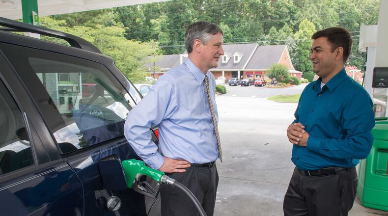 The Rev. Chris George, pastor of Smoke Rise Baptist Church, talks with Malik Waliyani. CONTRIBUTED BY CLARK R. HILL