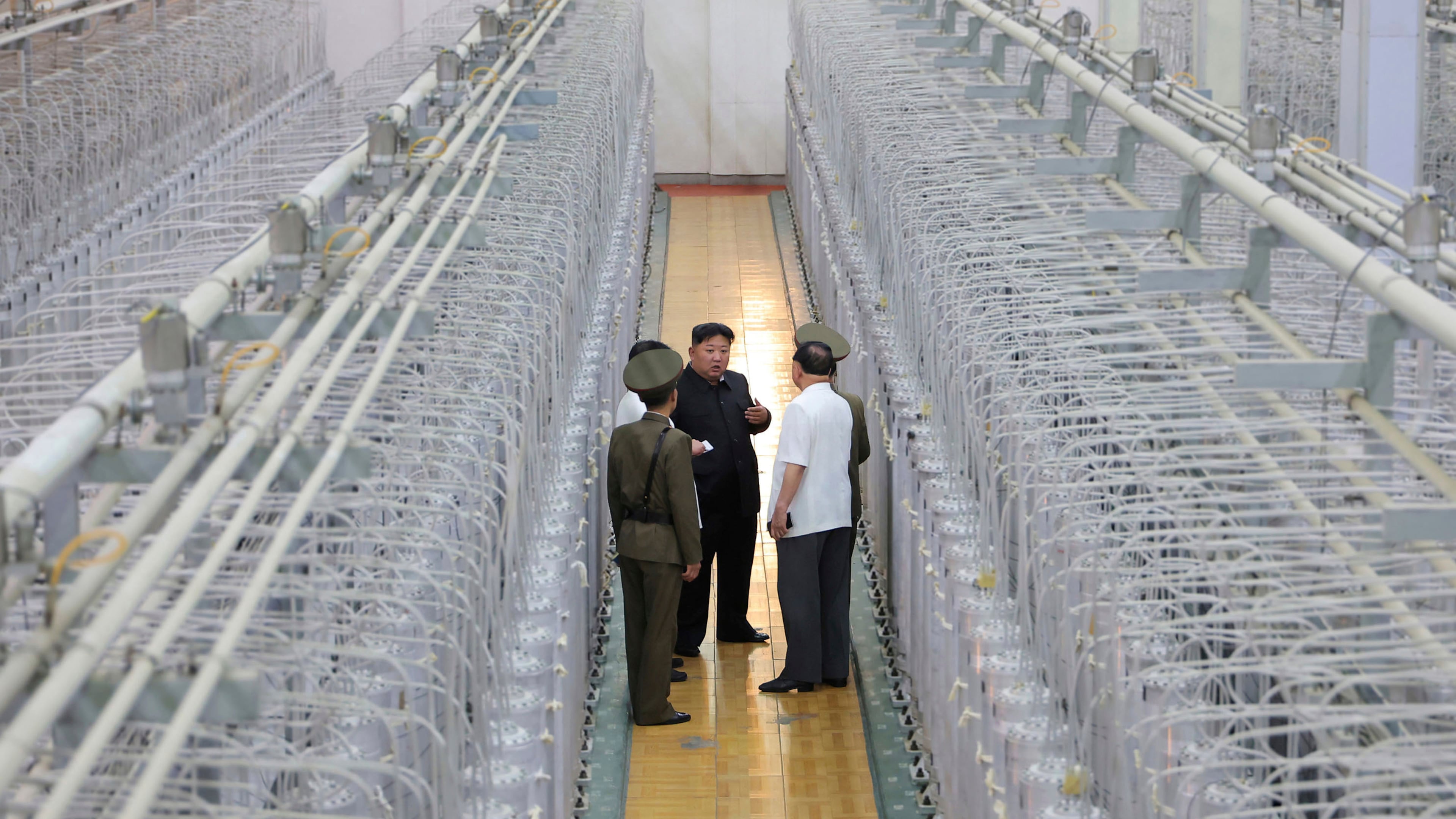 FILE - This undated photo provided on Sept. 13, 2024, by the North Korean government shows its leader Kim Jong Un, center, on an inspecting visit at what they say is an institute of nuclear weapons and a facility for nuclear materials at an undisclosed location in North Korea. Independent journalists were not given access to cover the event depicted in this image distributed by the North Korean government. The content of this image is as provided and cannot be independently verified. Korean language watermark on image as provided by source reads: "KCNA" which is the abbreviation for Korean Central News Agency. (Korean Central News Agency/Korea News Service via AP, File)