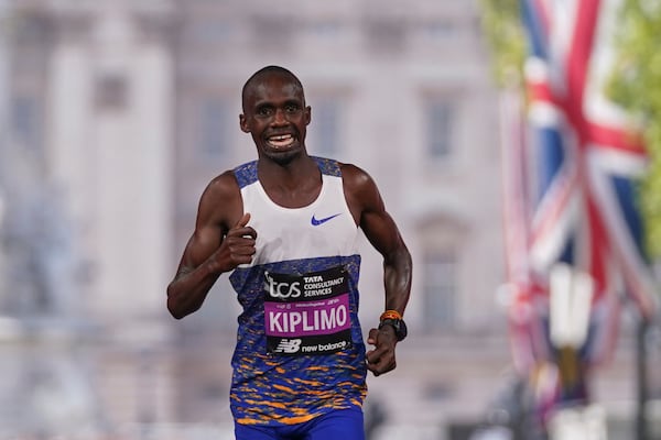 Jacob Kiplimo of Uganda, crosses the line to place second in the men's race at the London Marathon, Sunday, April 27, 2025. (AP Photo/Alberto Pezzali)