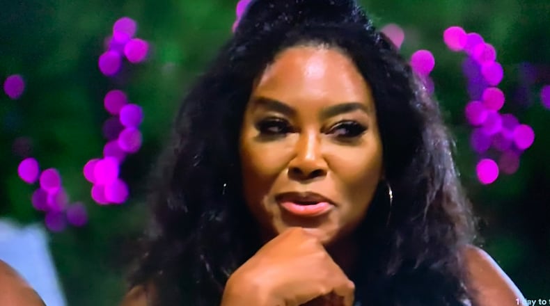 Kenya Moore during season 13 episode 11 "Real Housewives of Atlanta" getting way too much joy "investigating" who slept with the male stripper during the beach trip. BRAVO