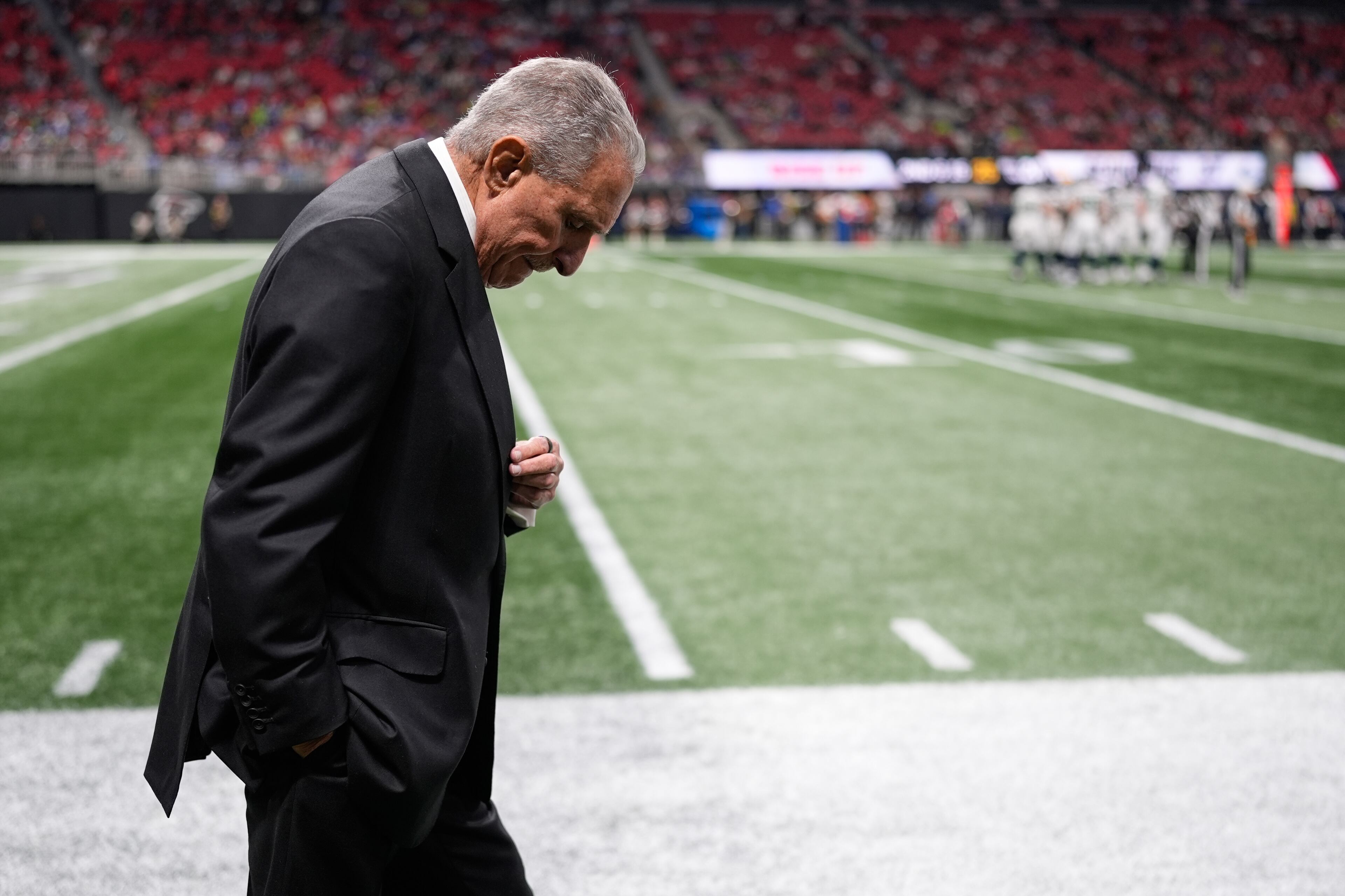 Falcons owner Arthur Blank walks the sideline during the second half of Sunday's blowout loss to the Seahawks.