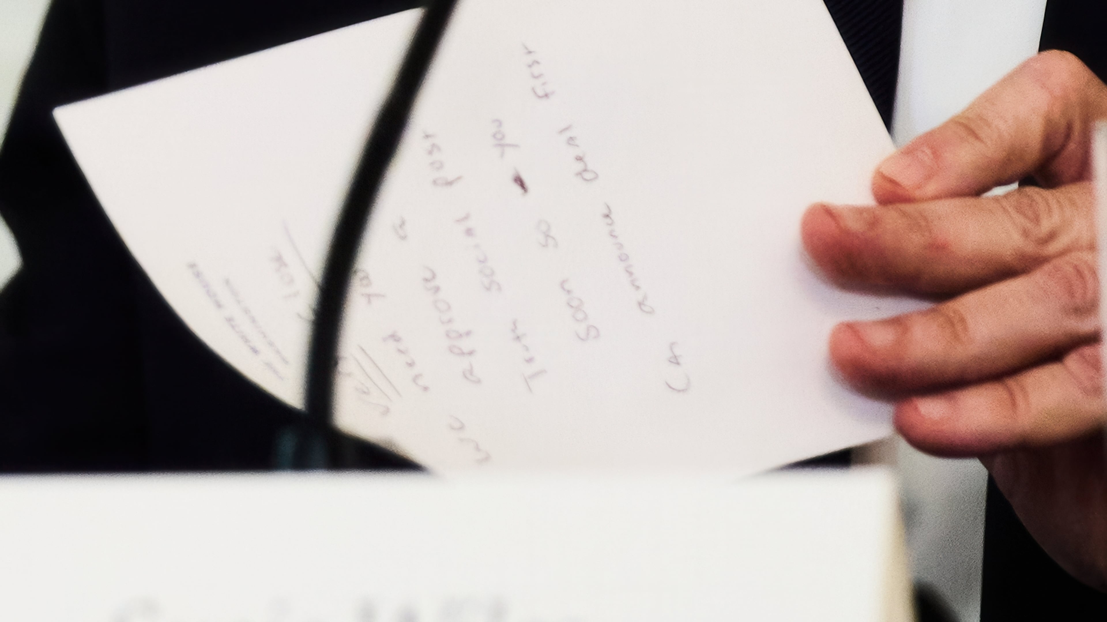 Secretary of State Marco Rubio writes a note before handing it to President Donald Trump during a roundtable meeting on antifa in the State Dining Room at the White House, Wednesday, Oct. 8, 2025, in Washington. (AP Photo/Evan Vucci)