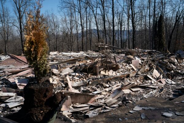 FILE - Debris litters an area from a home that was lost to a wildfire, March 26, 2025, in Lake Lure, N.C.. (AP Photo/Allison Joyce, File)