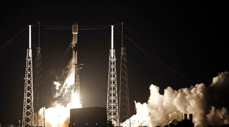 A Falcon 9 SpaceX rocket, with a payload of 60 satellites for SpaceX's Starlink broadband network, lifts off from Space Launch Complex 40 at the Cape Canaveral Air Force Station in Cape Canaveral, Fla., Thursday, May 23, 2019. (AP Photo/John Raoux)