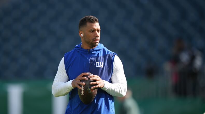 FILE - New York Giants' Russell Wilson warms up before an NFL football game against the Philadelphia Eagles, Oct. 26, 2025, in Philadelphia. (AP Photo/Matt Slocum, File)