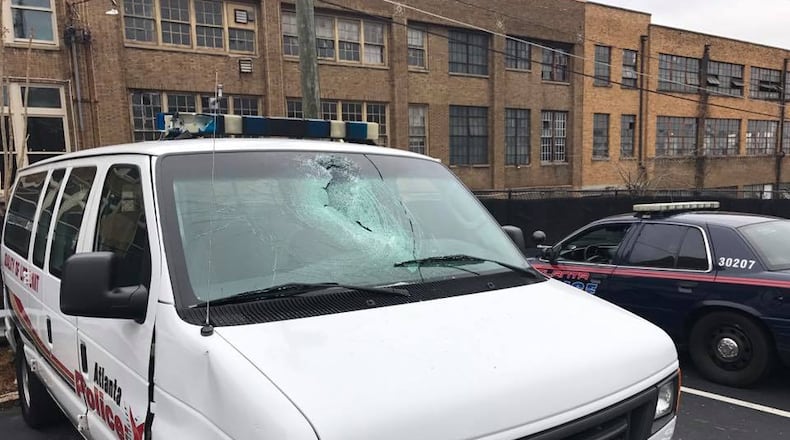 An Atlanta police van windshield was smashed with a rock Monday morning on Peachtree Street. (Credit: Heyward Wescott)