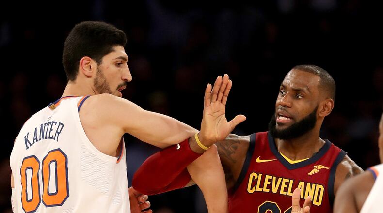 Enes Kanter #00 of the New York Knicks and LeBron James #23 of the Cleveland Cavaliers fight for position at Madison Square Garden on November 13, 2017 in New York City.
