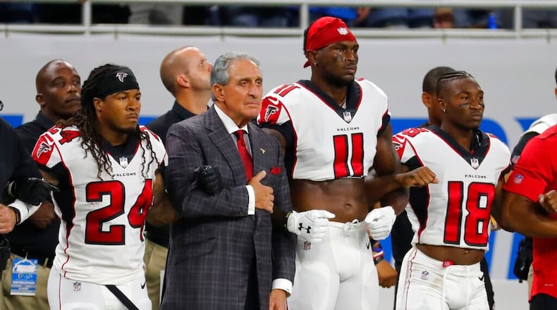 Atlanta Falcons owner Arthur Blank stands with his players during the national anthem before an NFL football game against the Detroit Lions, Sunday, Sept. 24, 2017, in Detroit. (AP Photo/Rick Osentoski)