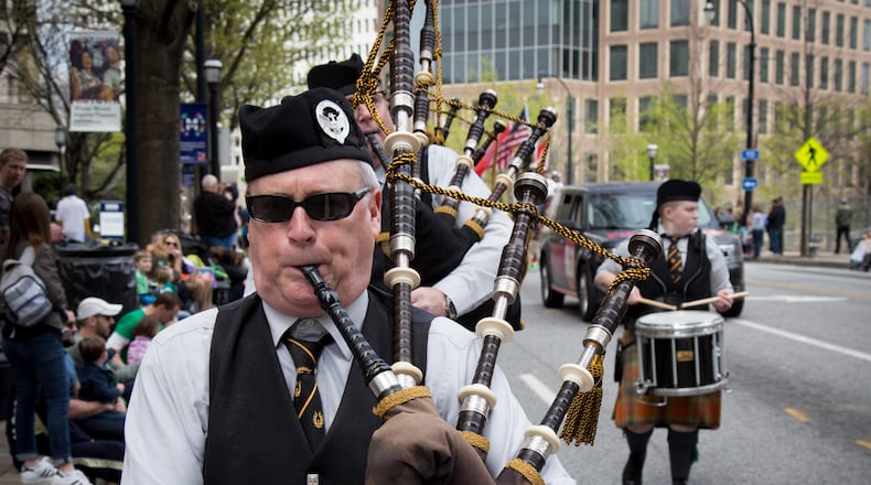 A Scottish Bagpipe Band makes their way up Peachtree Street during the St. Patrickâs Parade in Atlanta Ga Saturday, March 11, 2016. The heavily attended parade preceded the actual holiday this Friday, when, according to a recent national survey, people much prefer wearing green to drinking it. STEVE SCHAEFER / SPECIAL TO THE AJC