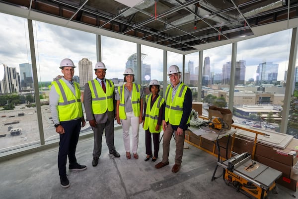Clark Hill attorneys, from left to right, Mark Florak, Henry "Butch" Bailey, Christina Moore, Manori de Silva and Bryan Tyson check construction progress in one of the conference rooms of their new 7th-floor office space in Buckhead on August 12, 2025. The space is scheduled to be ready by the end of September. (Jason Getz / AJC)