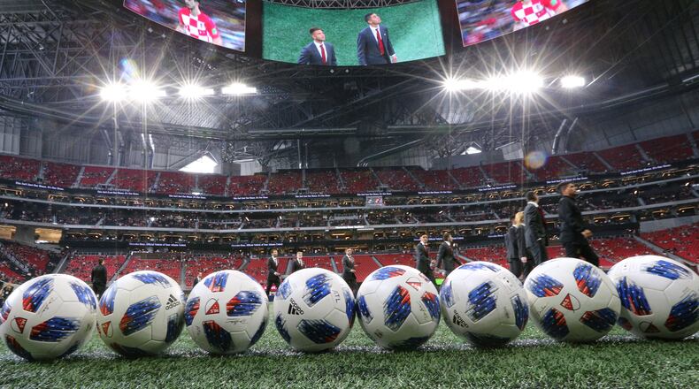 Atlanta United players take in the World Cup final on the halo board as they arrive in Mercedes-Benz Stadium to play the Seattle Sounders in a MLS soccer game on Sunday, July 15, 2018, in Atlanta.     Curtis Compton/ccompton@ajc.com