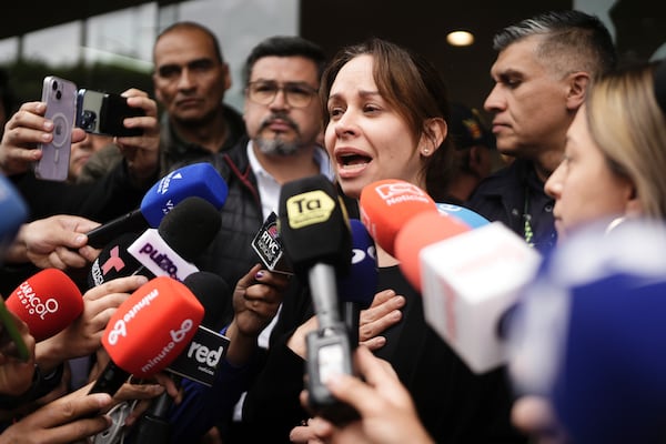 Maria Claudia Tarazona, the wife of Colombian Senator Miguel Uribe Turbay who was shot at a political rally, talks to the press outside the clinic where he is being treated, in Bogota, Colombia, Sunday, June 8, 2025. (AP Photo/Ivan Valencia)