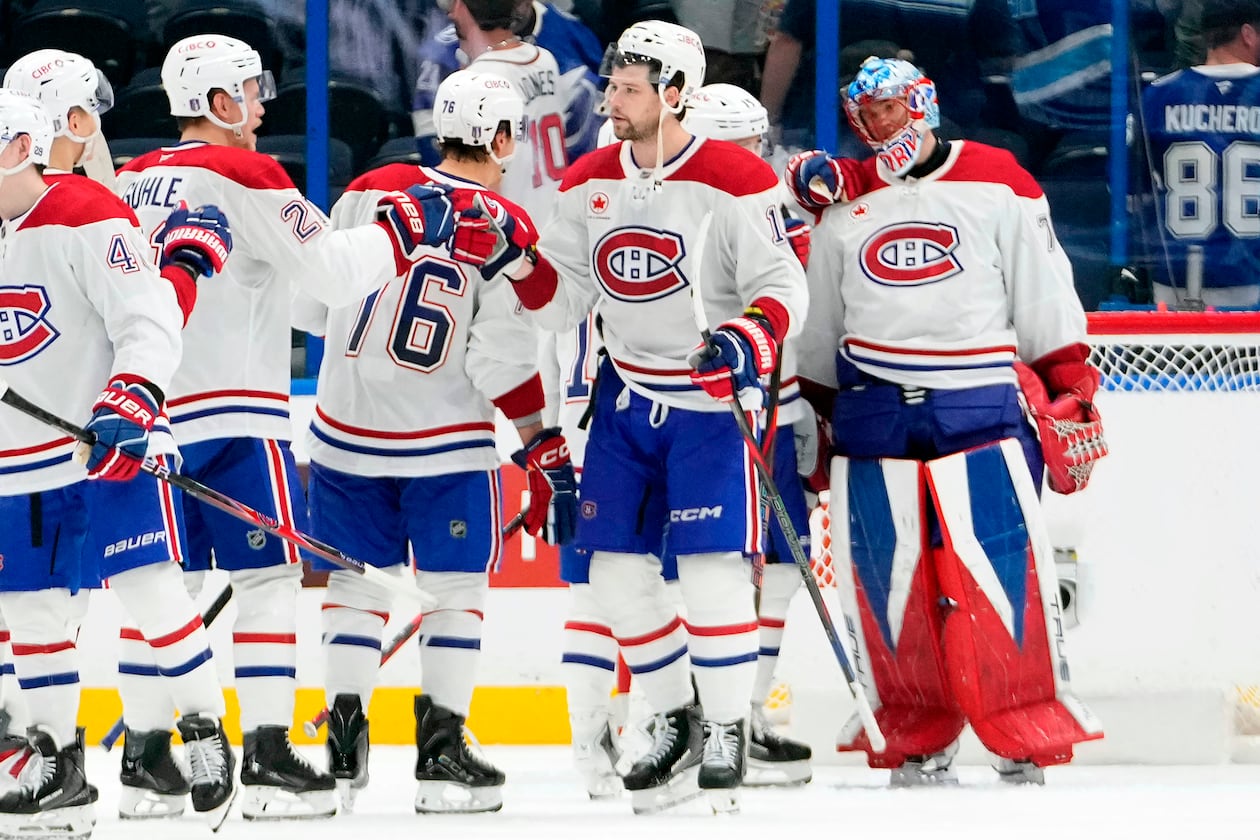 Montréal Canadiens players celebrate their win over the Tampa Bay Lightning in Game 5 of an NHL hockey Stanley Cup first-round playoff series, Wednesday, April 29, 2026, in Tampa, Fla. (AP Photo/Chris O'Meara)