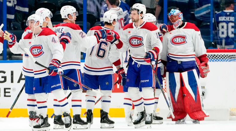 Montréal Canadiens players celebrate their win over the Tampa Bay Lightning in Game 5 of an NHL hockey Stanley Cup first-round playoff series, Wednesday, April 29, 2026, in Tampa, Fla. (AP Photo/Chris O'Meara)