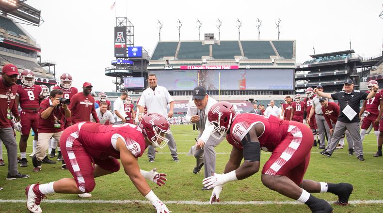 Dan Archibong #95 and Michael Dogbe #98 of the Temple Owls line up against each other as head coach Geoff Collins blows the whistle prior to the game against the Connecticut Huskies at Lincoln Financial Field on October 14, 2017 in Philadelphia, Pennsylvania. (Photo by Mitchell Leff/Getty Images)